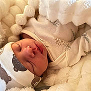 Colton joined the competition — help win amazing prizes! baby, sleeping, blanket, hat, cute, infant, cozy, soft, face, newborn, warm, clothing, portrait, peaceful, babywear, pajamas, wrapped, rest, child, indoors