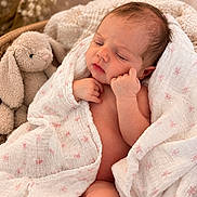 Ada joined the competition — help win amazing prizes! newborn, baby, infant, sleeping, portrait, close_up, face, hands, swaddle, blanket, floral, stuffed_animal, bunny, cozy, nursery, indoor, chair, soft_lighting, peaceful, photography