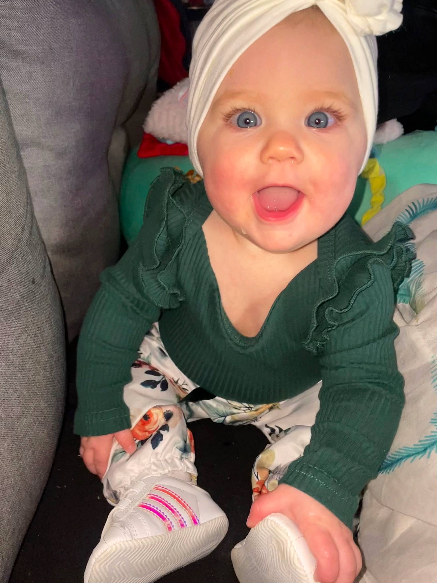 Leeva participe au concours pour gagner de l'argent avec cette photo : arm, baby, baby_toddler_clothing, cheek, dress, eye, finger, hand, head, human_body, iris, leg, lip, person, photograph, pink, skin, sleeve, smile, surprise