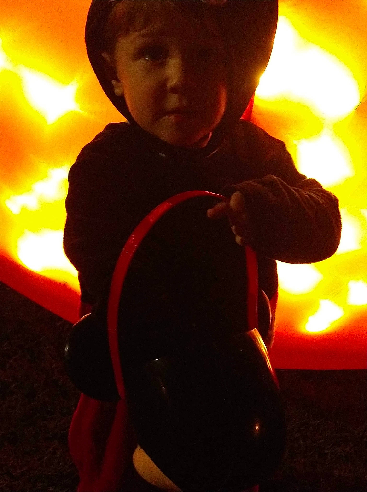 Keagan Brown joined the competition — help win amazing prizes! backlighting, child, event, flash_photography, fun, gesture, happy, head, heat, helmet, hoodie, light, orange, people_in_nature, person, personal_protective_equipment, sitting, sky, toddler, tradition