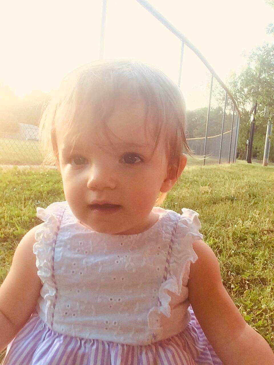 Alana Grace joined the competition — help win amazing prizes! baby, beauty, blond, cheek, child, dress, eye, face, facial_expression, grass, hair, head, lip, nose, person, pink, skin, smile, summer, sunlight