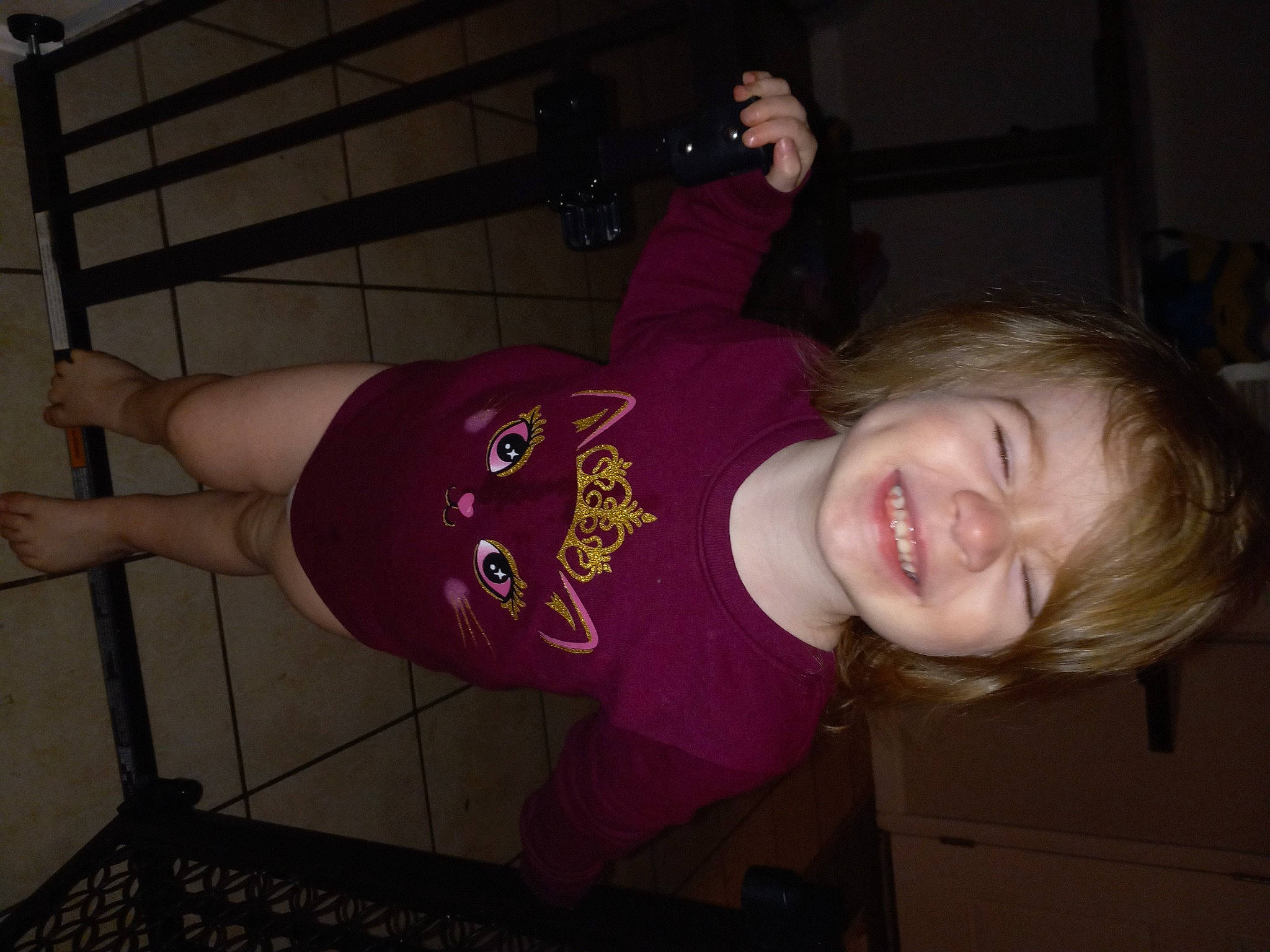 Cassie is registered to the contest to win money with this photo: baby_toddler_clothing, elbow, finger, floor, flooring, fun, human_body, human_leg, joint, joy, knee, leg, mammal, mouth, muscle, person, shoulder, smile, t_shirt, thigh