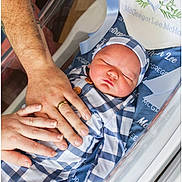 Mcgregor joined the competition — help win amazing prizes! newborn, baby, sleeping, infant, hands, adult, bassinet, bedding, checkered_clothing, blue, white, peaceful, resting, closeup, family, protection, love, indoor, soft_light, portrait
