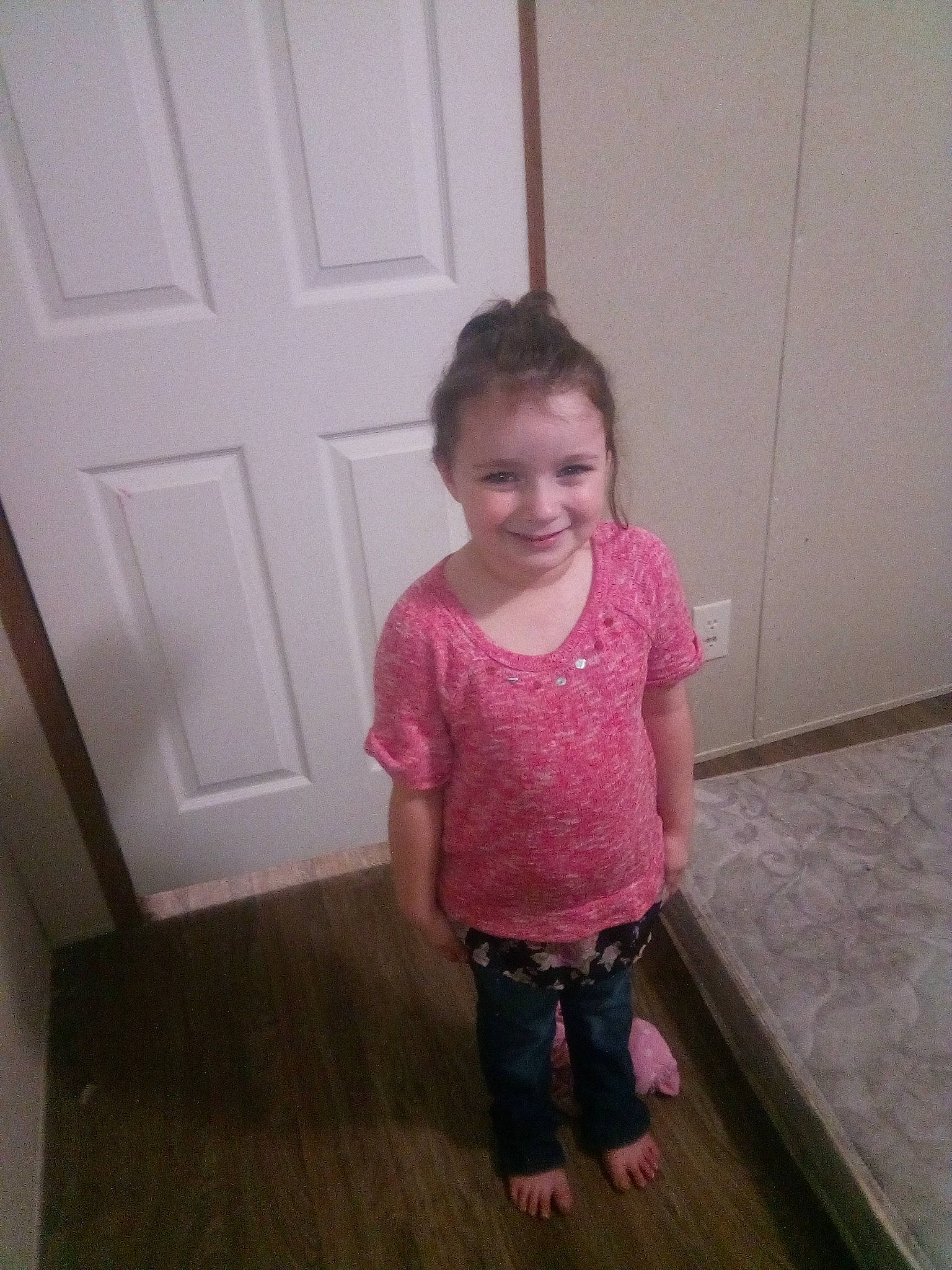 Sophia is registered to the contest to win money with this photo: baby_toddler_clothing, cheek, door, floor, flooring, hardwood, human_body, joy, laminate_flooring, magenta, pattern, person, plank, sleeve, smile, toddler, trunk, varnish, waist, wood