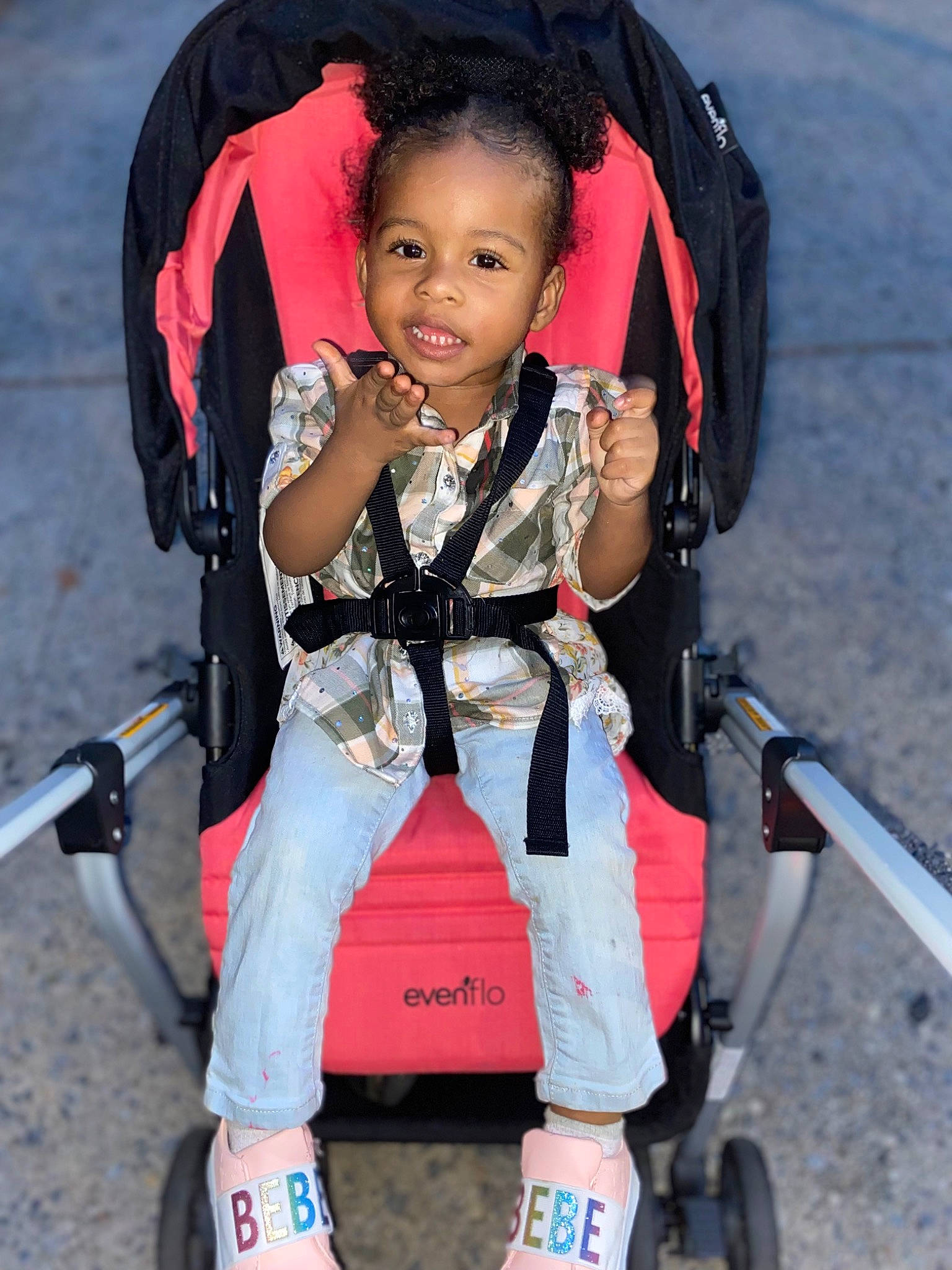 Xiah is registered to the contest to win money with this photo: baby_carriage, baby_products, beauty, child, comfort, electric_blue, fun, human_leg, knee, person, personal_protective_equipment, product, recreation, red, sitting, smile, thigh, tire, toddler, travel