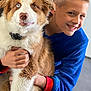 Pixel a rejoint le concours — aidez-le/la à gagner de superbes lots ! boy, dog, hugging, heterochromia, blue_outfit, red_outfit, indoor, smiling, pet, cute, fur, child, friendship, happy, portrait, floor, cozy, playful, closeup, warm