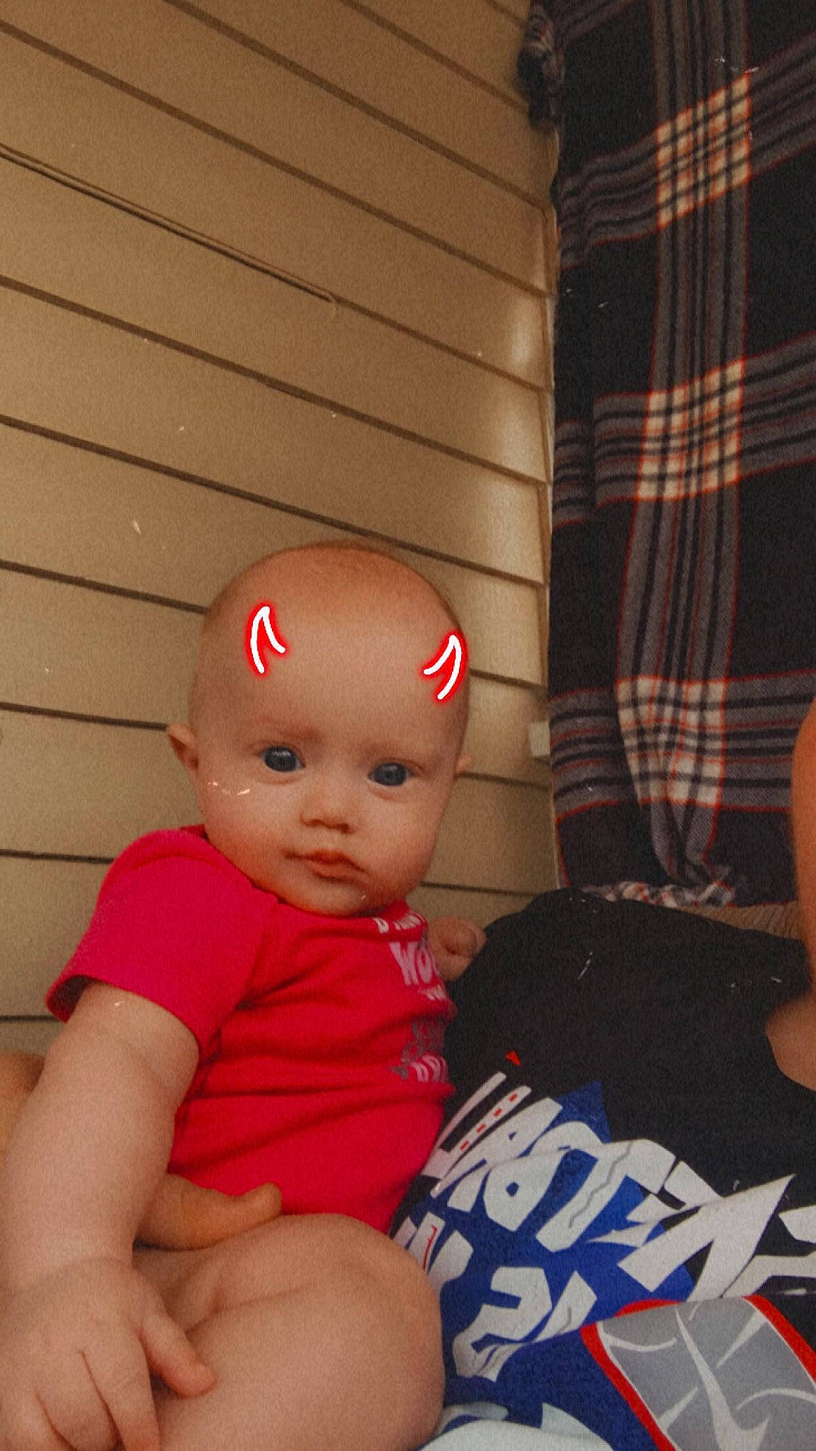 Amelia joined the competition — help win amazing prizes! baby, baby_toddler_clothing, cap, carmine, child, curtain, elbow, flooring, fun, happy, human_leg, pattern, person, personal_protective_equipment, plaid, room, sitting, t_shirt, tartan, thigh