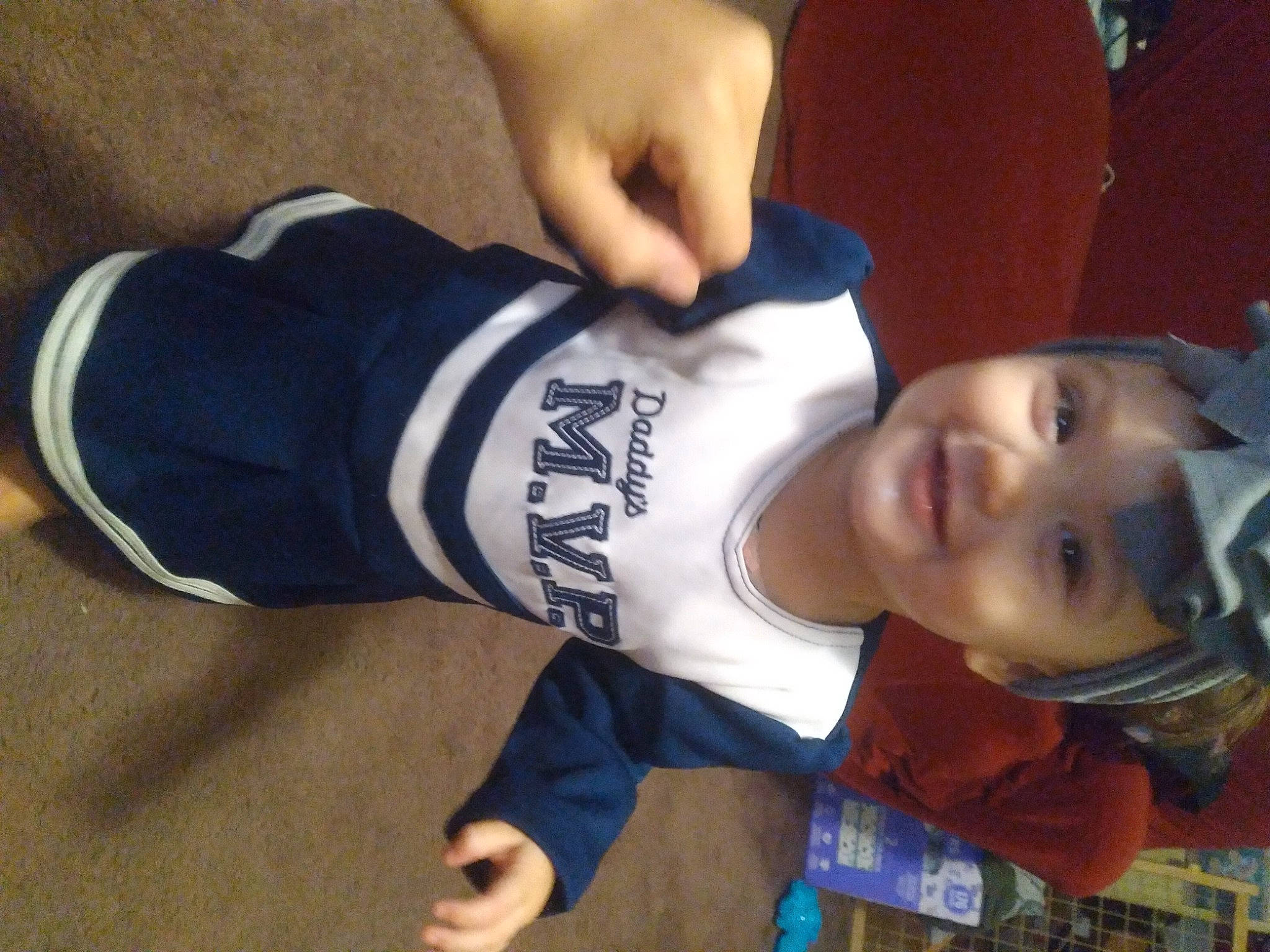 Sarri is registered to the contest to win money with this photo: chest, child, elbow, gesture, happy, headwear, human_leg, jersey, joy, knee, leisure, neck, person, sleeve, smile, sportswear, t_shirt, thigh, thumb, toddler