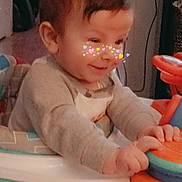 Bowen joined the competition — help win amazing prizes! baby, child, indoor, toy, walker, smiling, playing, face, clothing, hands, furniture, heart_filter, cute, person, young_child, happy, colorful, seat, room, hair
