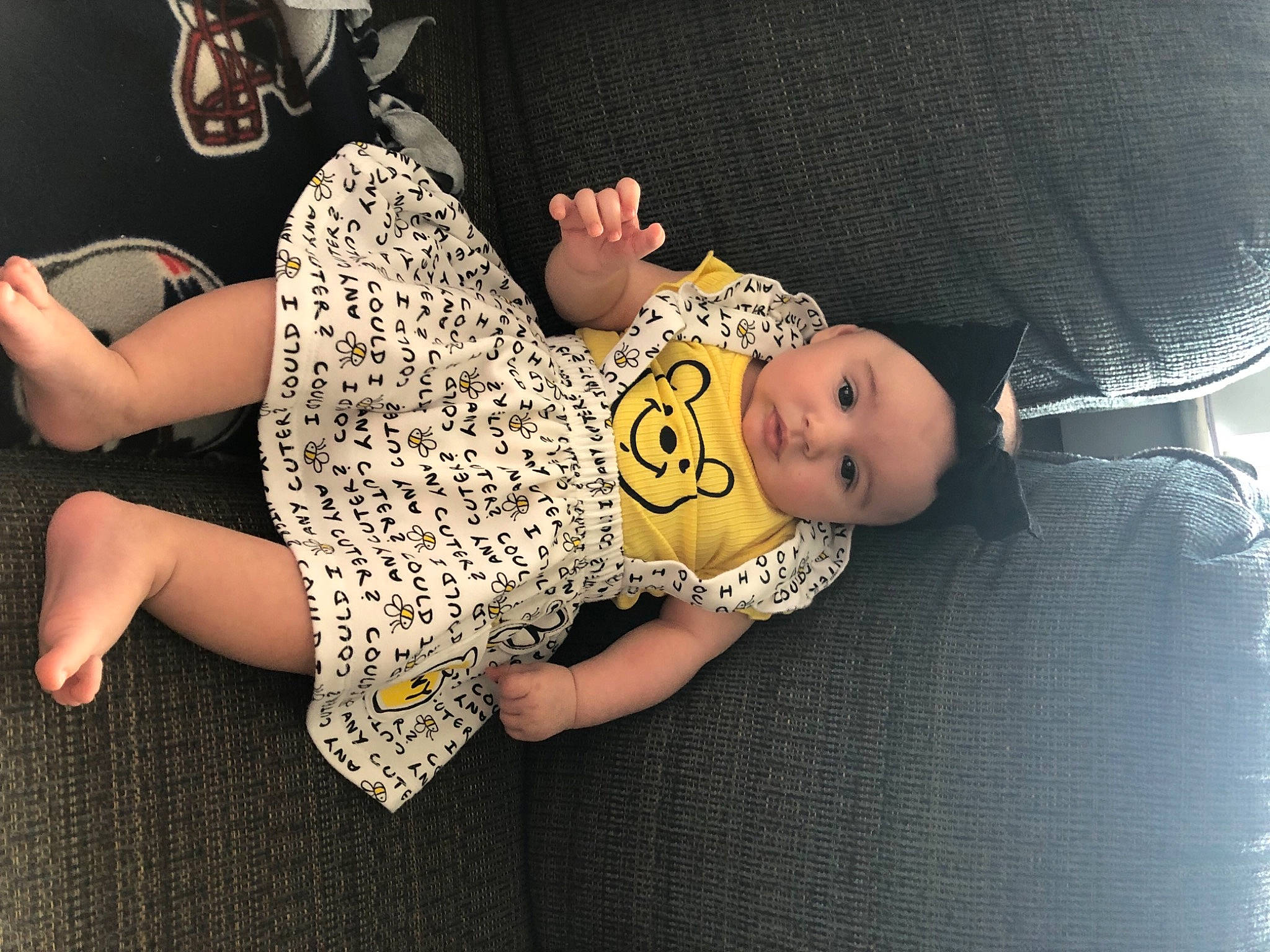 Calliope joined the competition — help win amazing prizes! baby, baby_toddler_clothing, barefoot, child, comfort, flooring, foot, headgear, headwear, human_leg, joint, knee, linens, pattern, person, room, sitting, sleeve, thigh, toddler