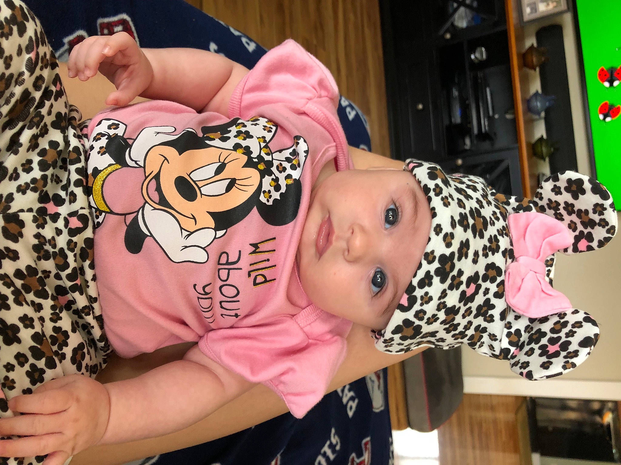 Calliope is registered to the contest to win money with this photo: baby, baby_toddler_clothing, cheek, child, facial_expression, flesh, fun, happy, hat, headwear, mammal, nail, person, pink, room, thigh, toddler