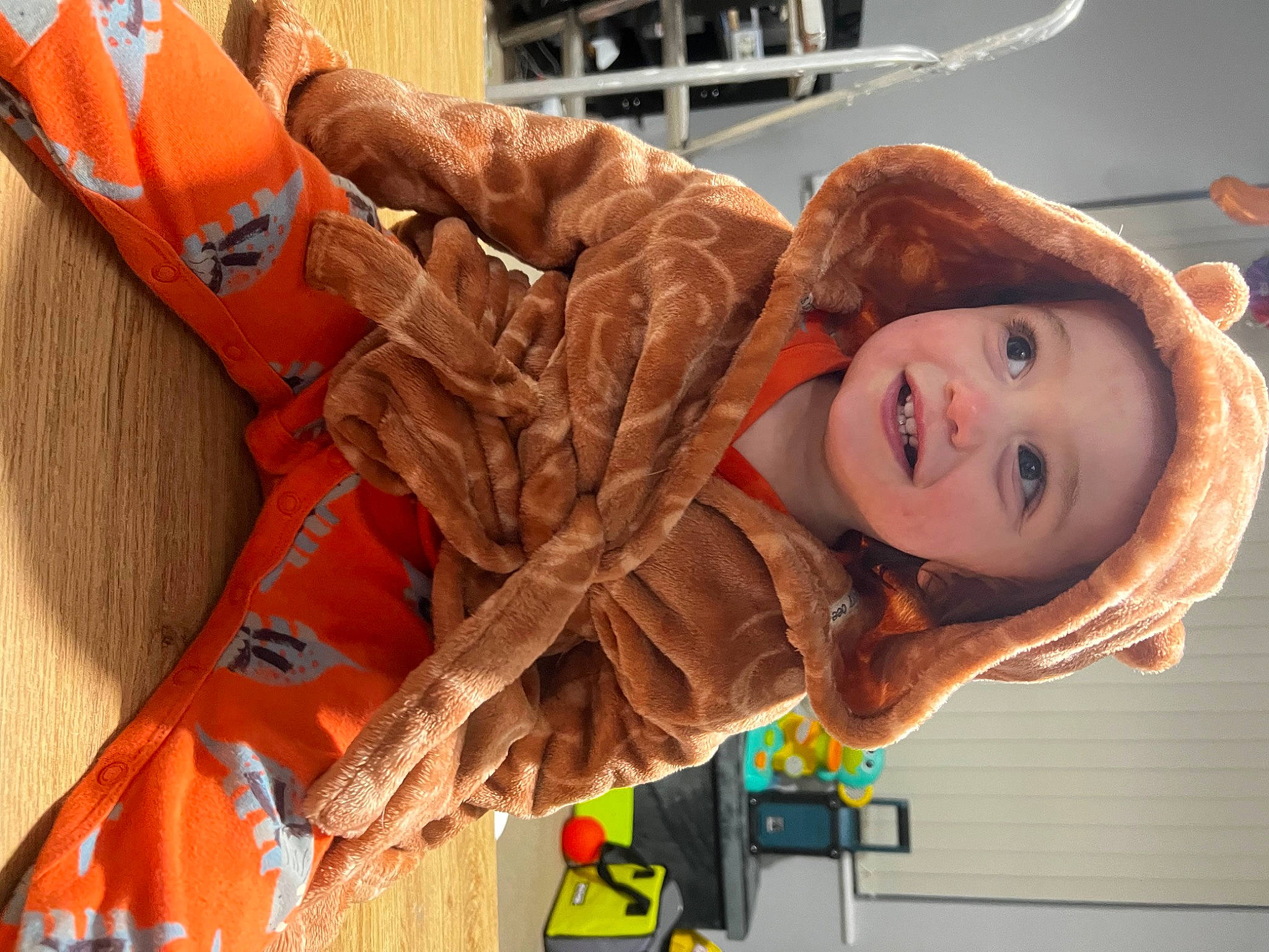 George is registered to the contest to win money with this photo: child, fun, happy, hat, joy, leisure, orange, person, personal_protective_equipment, portrait_photography, smile, toddler, vacation, wood