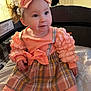 Liliana is registered to the contest to win money with this photo: baby, bow, child, clothing, cute, dress, girl, happy, headband, indoors, infant, person, plaid, playpen, portrait, ruffles, sitting, smiling, soft_lighting, young_child