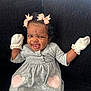 Pync is registered to the contest to win money with this photo: baby, bodypart, clothing, costume, couch, dress, face, finger, furniture, glove, hand, happy, head, laughing, mouth, person, photography, portrait, smile, teeth