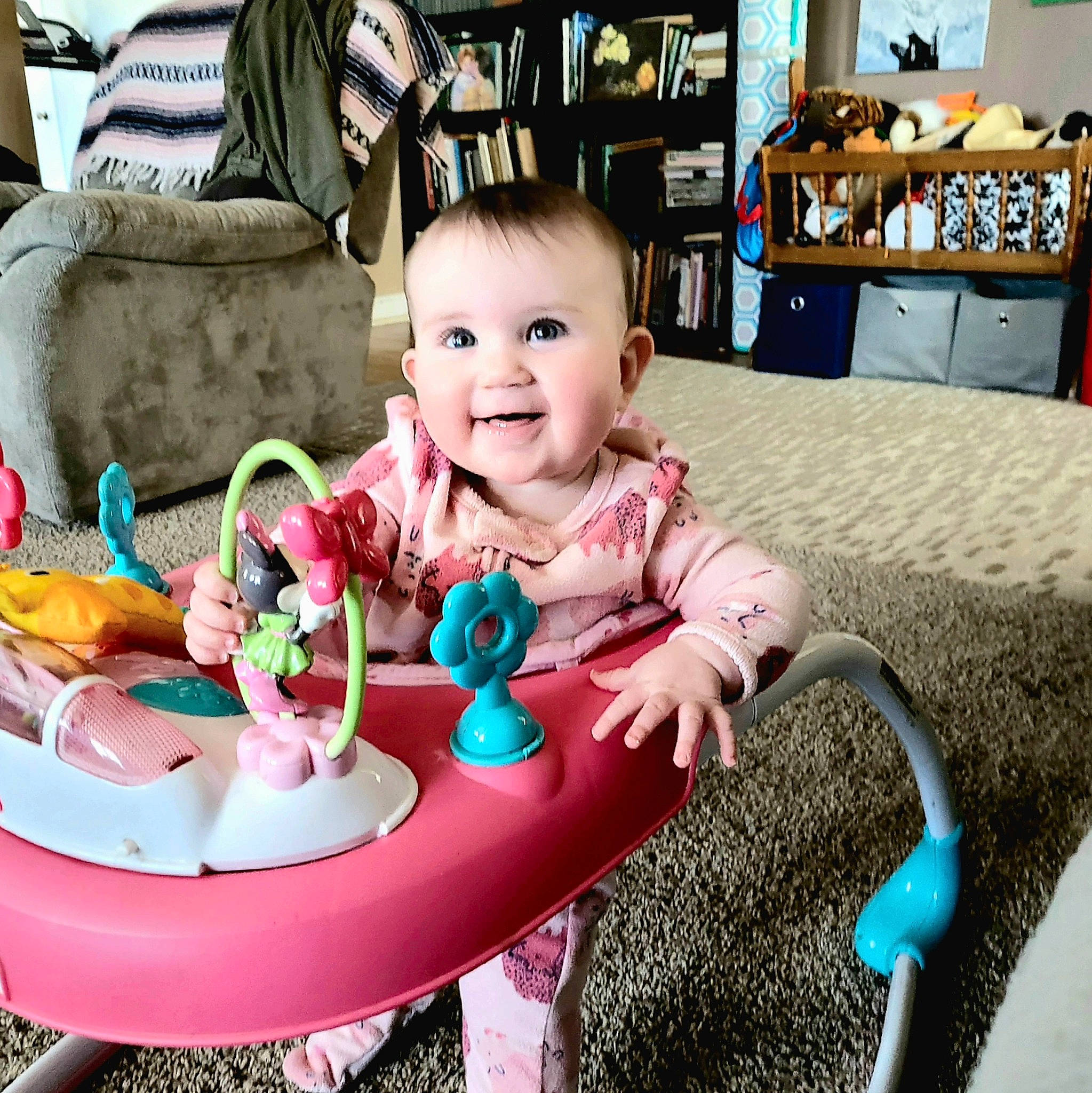 Aisling is registered to the contest to win money with this photo: baby, baby_toddler_clothing, bookcase, child, event, fun, happy, holiday, icing, joy, person, pink, plate, play, sharing, shelf, sitting, smile, table, tableware