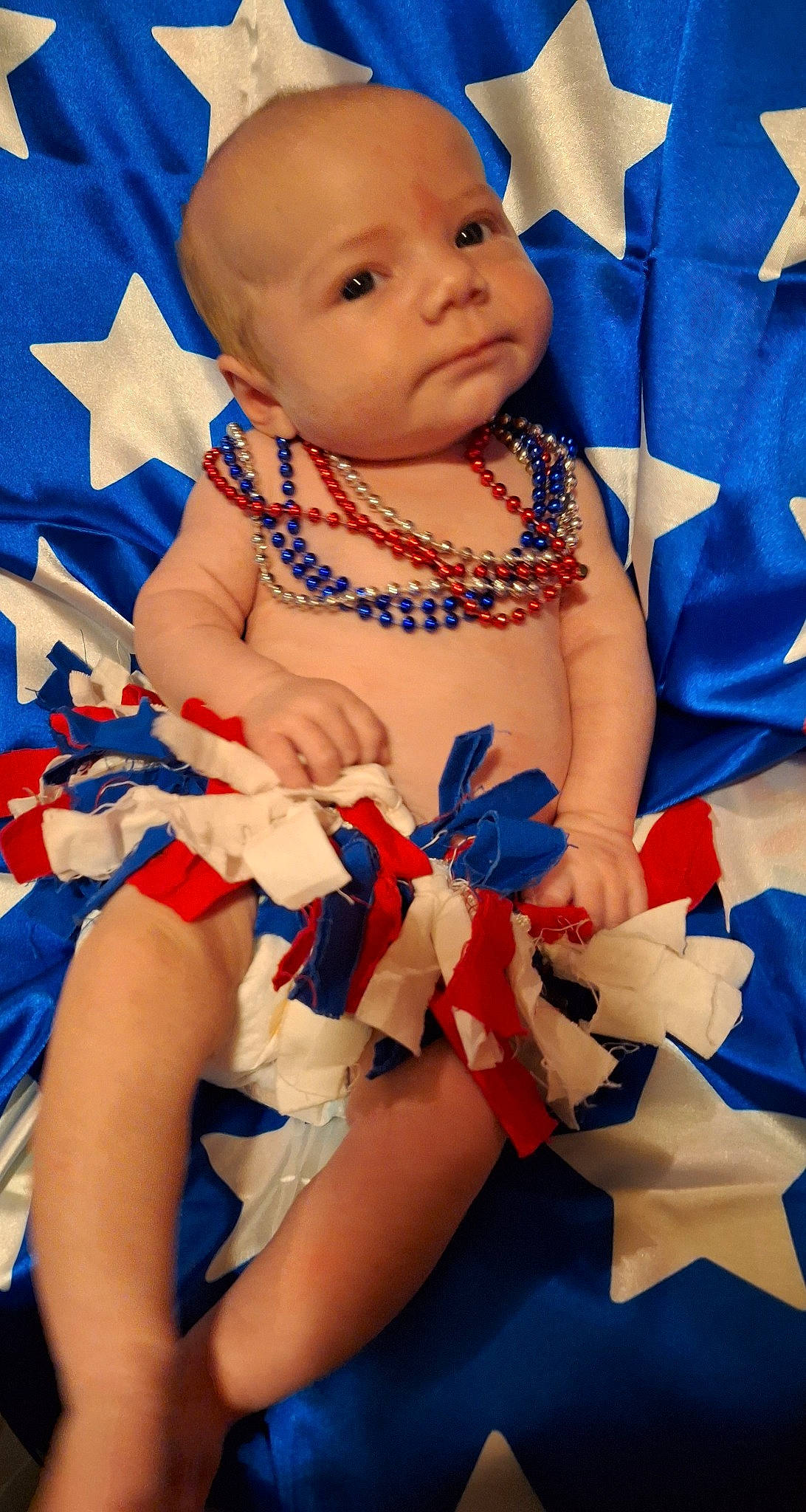 Dawn is registered to the contest to win money with this photo: azure, baby, baby_toddler_clothing, blue, cheek, child, electric_blue, event, face, finger, fun, happy, nail, person, red, skin, thumb, toddler, white, wrist