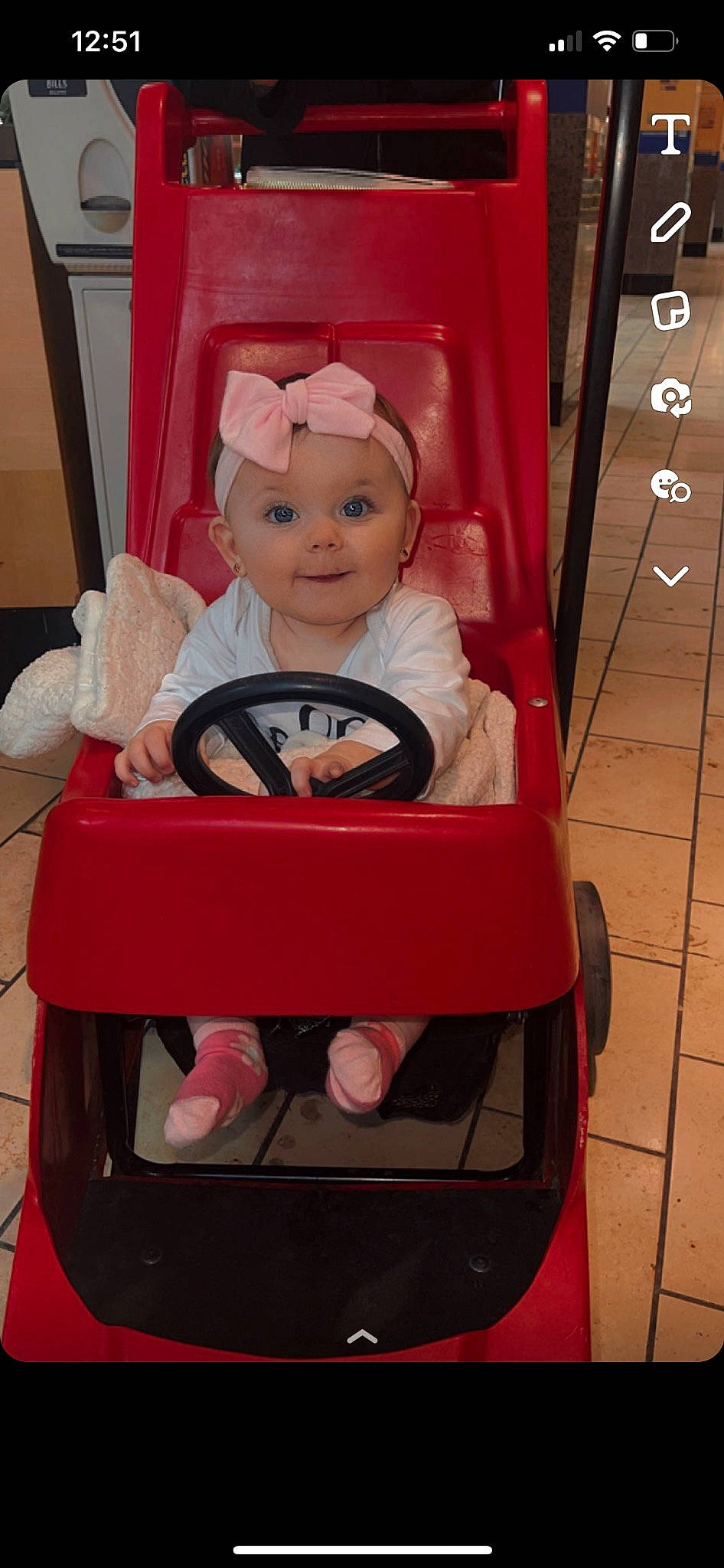 Lakelynn is registered to the contest to win money with this photo: baby, baby_carriage, baby_products, baby_safety, baby_toddler_clothing, baby_toys, chair, cheek, child, happy, headwear, magenta, person, pink, product, red, riding_toy, sitting, smile, toddler