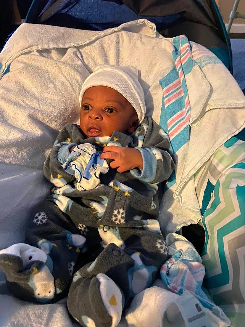 Jalen Young joined the competition — help win amazing prizes! baby, baby_carriage, baby_products, baby_safety, baby_sleeping, baby_toddler_clothing, child, comfort, electric_blue, fun, hat, headwear, linens, person, personal_protective_equipment, plastic, room, sitting, toddler, vacation