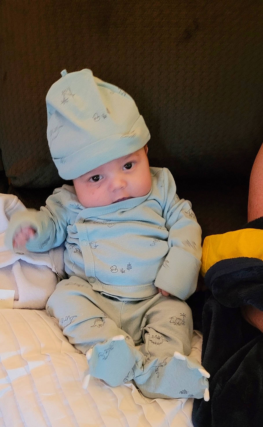 Mateo is registered to the contest to win money with this photo: baby, baby_products, baby_toddler_clothing, cap, cheek, child, comfort, fashion_accessory, flooring, fun, headwear, person, room, sitting, skin, sleeve, toddler, vacation