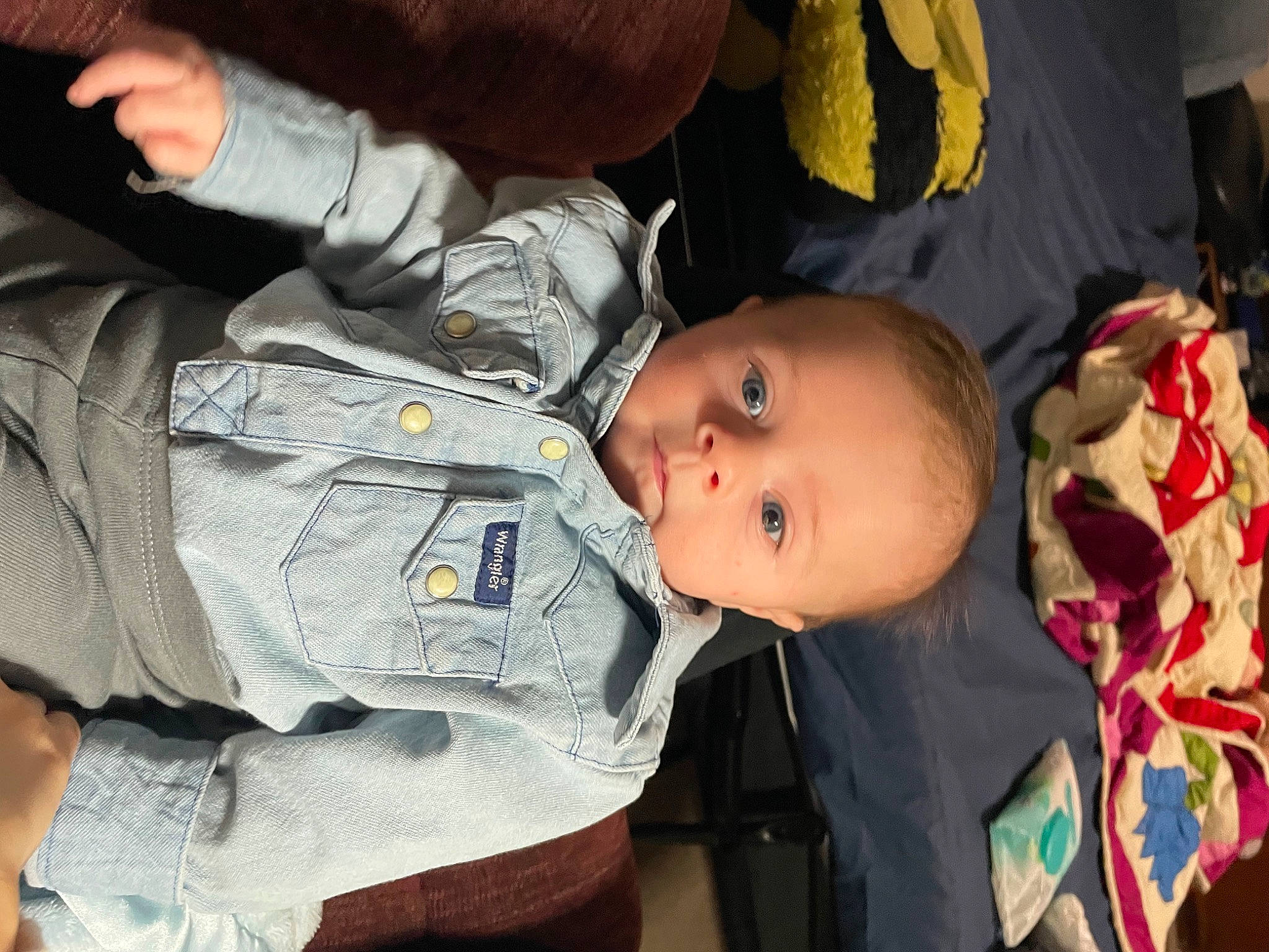 Clark is registered to the contest to win money with this photo: baby, baby_products, baby_toddler_clothing, cheek, child, comfort, eye, face, fun, gesture, happy, mouth, nose, organ, person, plant, product, sitting, skin, toddler