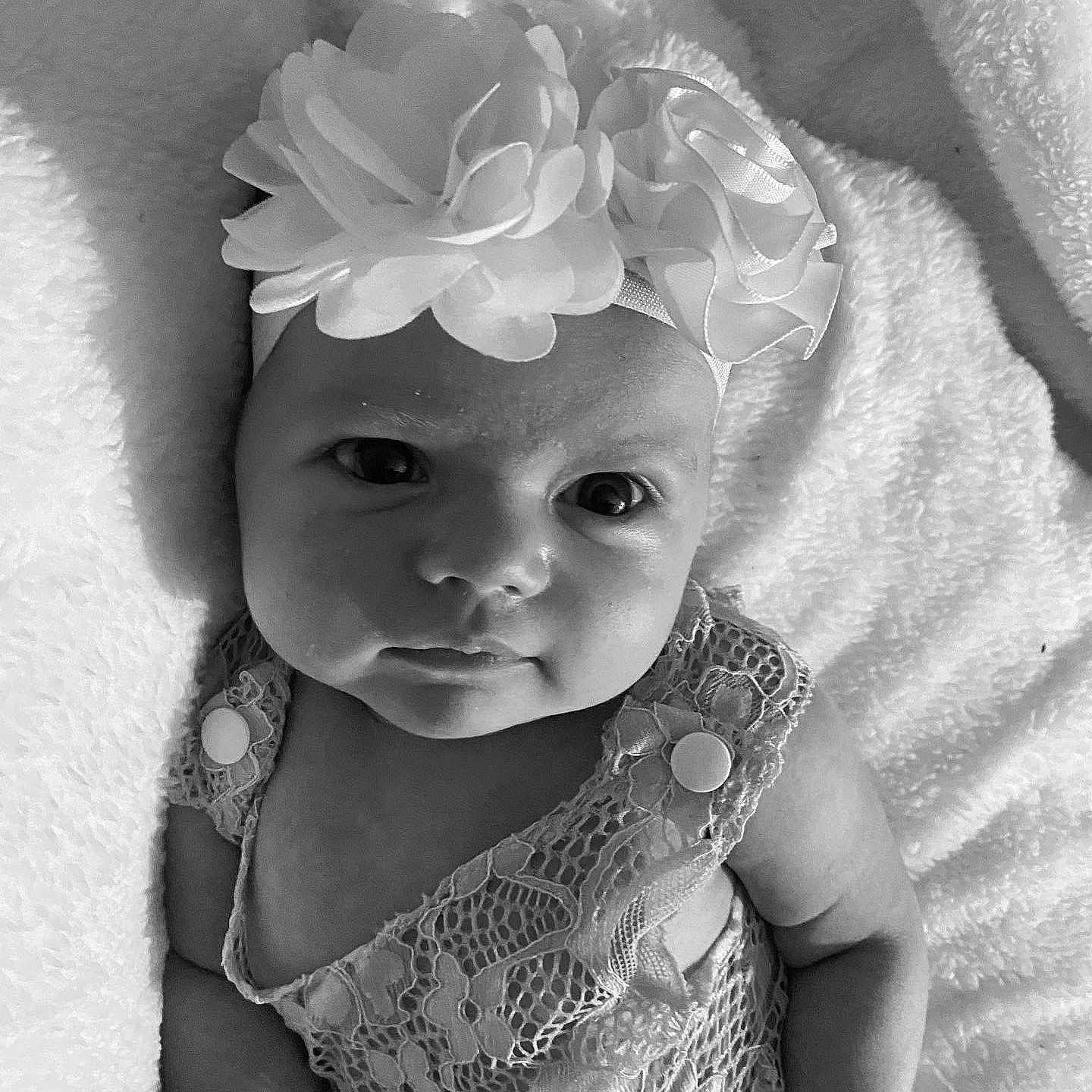 Ava joined the competition — help win amazing prizes! baby, baby_toddler_clothing, black_and_white, child, costume_hat, embellishment, flash_photography, flower, happy, headband, headgear, headpiece, iris, monochrome, monochrome_photography, petal, photograph, style, toddler, white