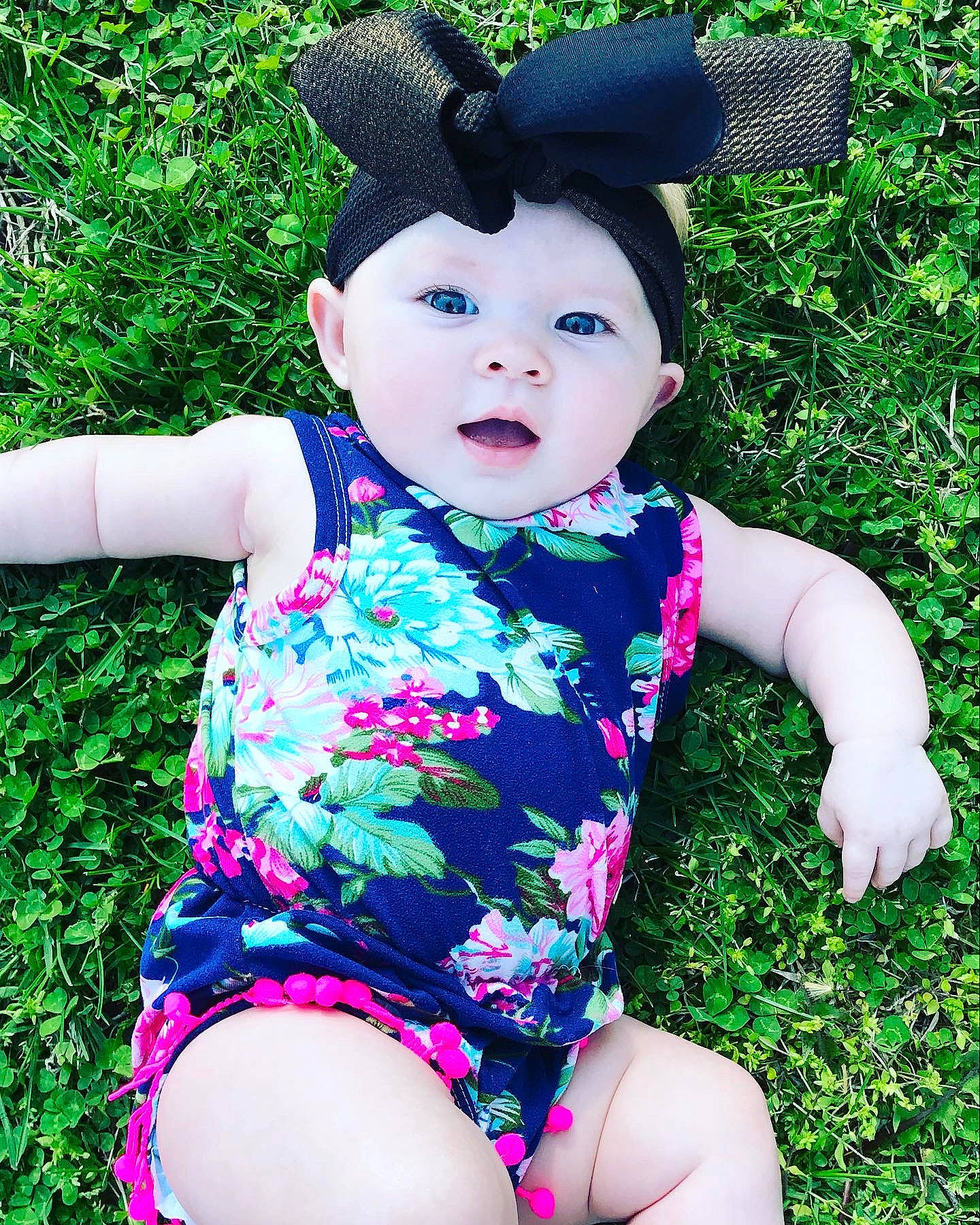 Kayzlee is registered to the contest to win money with this photo: baby_toddler_clothing, child, clothing, dress, grass, green, headgear, headwear, leotard, meadow, pattern, person, pink, plant, swimwear, toddler, toy