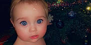 Sage is registered to the contest to win money with this photo: ammunition, baby, cartoon, christmas, christmasdecorations, christmastree, cosmetics, doll, face, festival, grenade, head, lighting, lipstick, person, photography, plant, portrait, toy, weapon