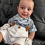 Ashton joined the competition — help win amazing prizes! baby, child, smiling, mohawk, shirt, suspenders, shorts, mittens, star_pattern, couch, leather, sitting, portrait, happy, cute, indoors, fashion, young_child, face, eyes