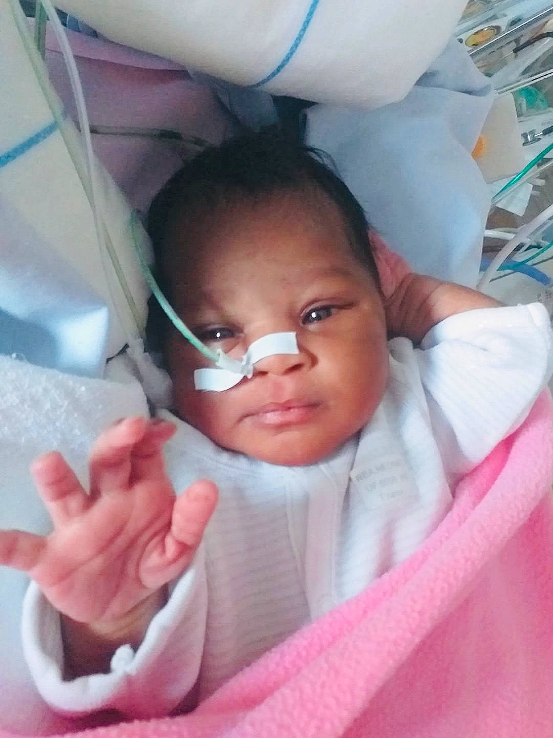 Naëlla a rejoint le concours — aidez-le/la à gagner de superbes lots ! baby, cheek, chin, comfort, eyebrow, eyelash, gesture, happy, head, iris, lip, mouth, neck, nose, person, pink, skin, sleeve, thumb, toddler