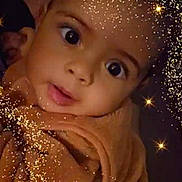 Jahwan a rejoint le concours — aidez-le/la à gagner de superbes lots ! baby, face, close_up, blanket, sparkles, glitter, brown, portrait, child, cute, expression, wrapped, soft, adorable, big_eyes, infant, warm, magic, glowing, dark_background