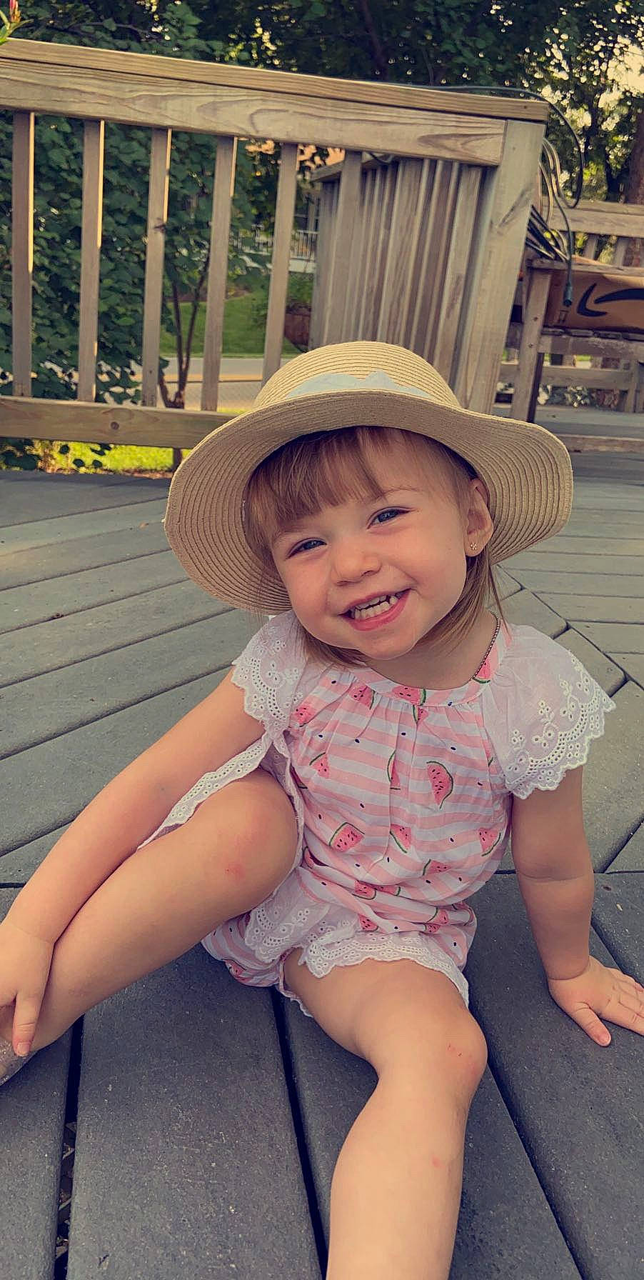 Rowen joined the competition — help win amazing prizes! baby, child, clothing, fashion_accessory, fun, hat, headgear, headwear, joy, person, sitting, skin, smile, summer, sun_hat, toddler, vacation