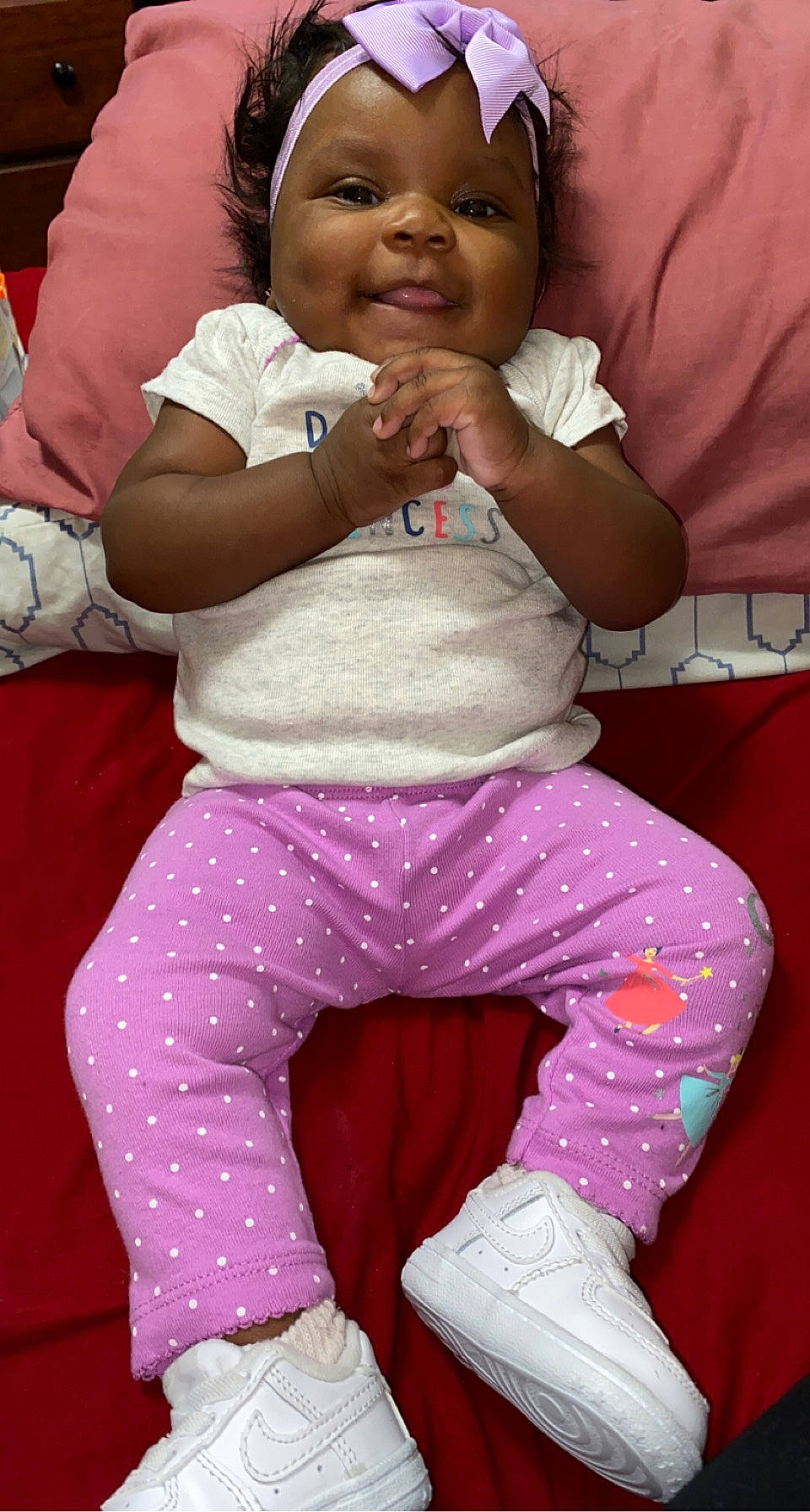 Ci'Airah is registered to the contest to win money with this photo: baby, baby_toddler_clothing, cheek, comfort, finger, fun, gesture, happy, headwear, joint, knee, lap, magenta, people, person, pink, purple, red, sleeve, thigh