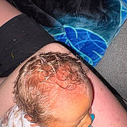 Lyra is registered to the contest to win money with this photo: baby, pacifier, curly_hair, blanket, lap, skin, person, infant, resting, closeup, indoor, human, head, child, comfort, toddler, cute, soft, peaceful, young