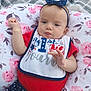 Alaya joined the competition — help win amazing prizes! baby, bib, blue_clothing, bow, celebration, cute, face, floral_cushion, hand, headband, holiday, infant, outdoor, pattern, portrait, red_clothing, resting, soft_texture, stars, young_child