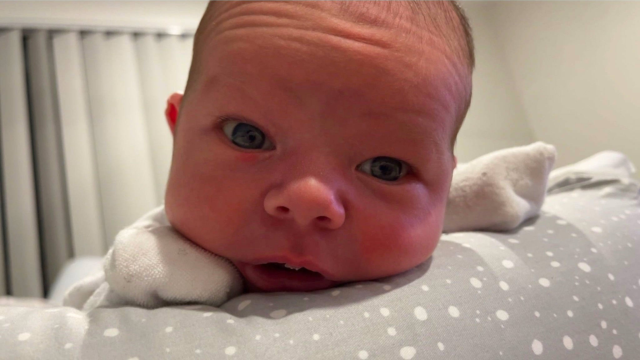 Cohen is registered to the contest to win money with this photo: baby, baby_toddler_clothing, cheek, child, chin, comfort, eye, eyebrow, eyelash, happy, head, iris, linens, lip, mouth, nose, person, skin, thumb, toddler