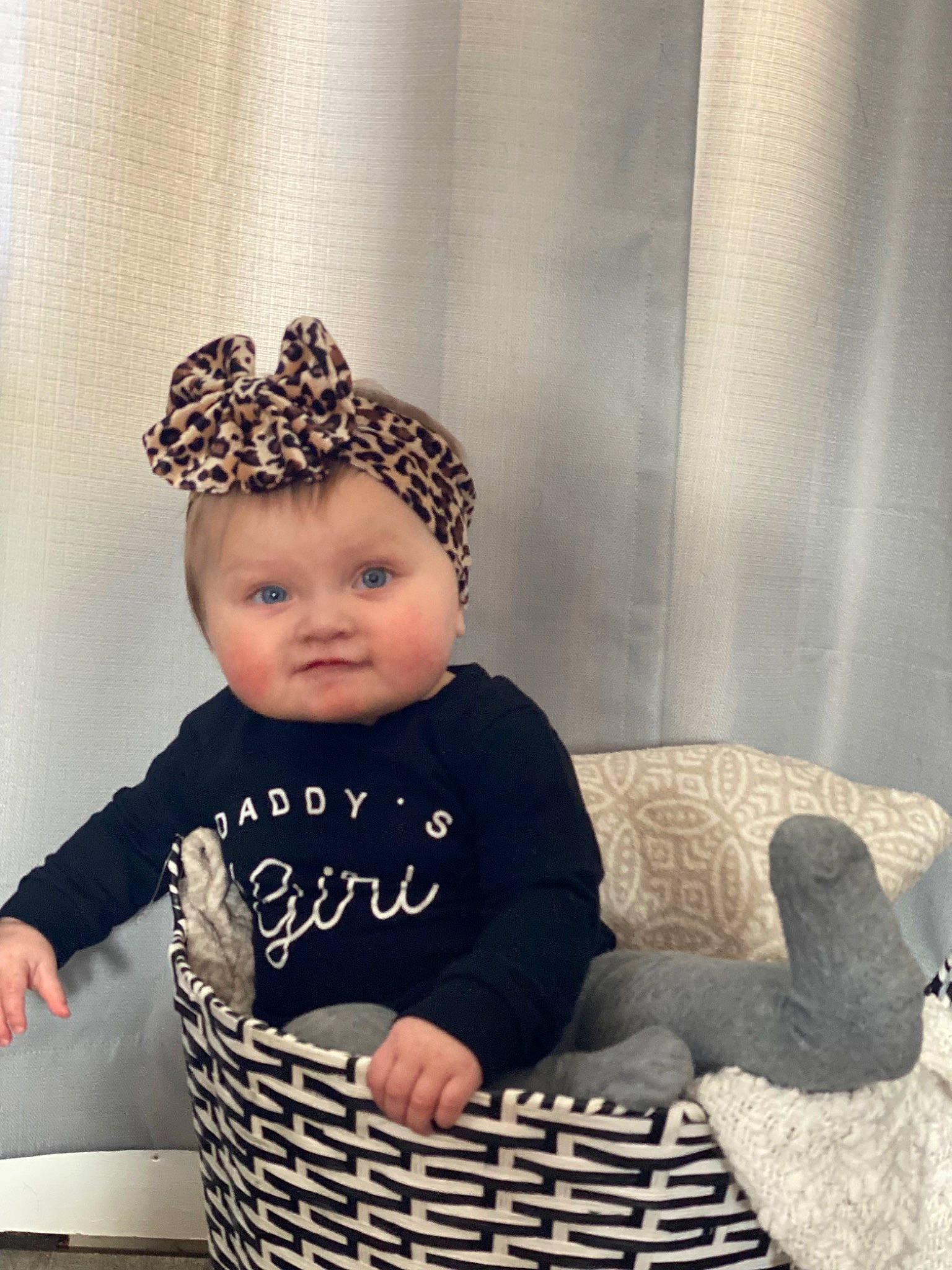 Meirah joined the competition — help win amazing prizes! baby, baby_toddler_clothing, basket, beanie, cap, child, comfort, costume_hat, curtain, fashion_accessory, happy, headband, headpiece, monochrome_photography, pattern, person, sitting, sleeve, toddler, white