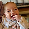 Lou participe au concours pour gagner de l'argent avec cette photo : arm, baby, bib, bokeh, candid, cheek, closeup, clothing, eyes, face, fingers, hand, indoor, infant, keyboard, mouth, musical_instrument, portrait, sleeve, smile