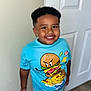 boy, burger, cartoon, casual, child, clothing, cute, door, funny, happy, indoor, person, pizza, portrait, shorts, smiling, standing, tshirt, wall, young
