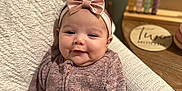 Sophia joined the competition — help win amazing prizes! accessories, baby, clothing, couch, face, furniture, happy, hat, head, homedecor, knitwear, newborn, pants, person, photography, portrait, sitting, sleeve, smile, sweater