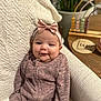 accessories, baby, clothing, couch, face, furniture, happy, hat, head, homedecor, knitwear, newborn, pants, person, photography, portrait, sitting, sleeve, smile, sweater