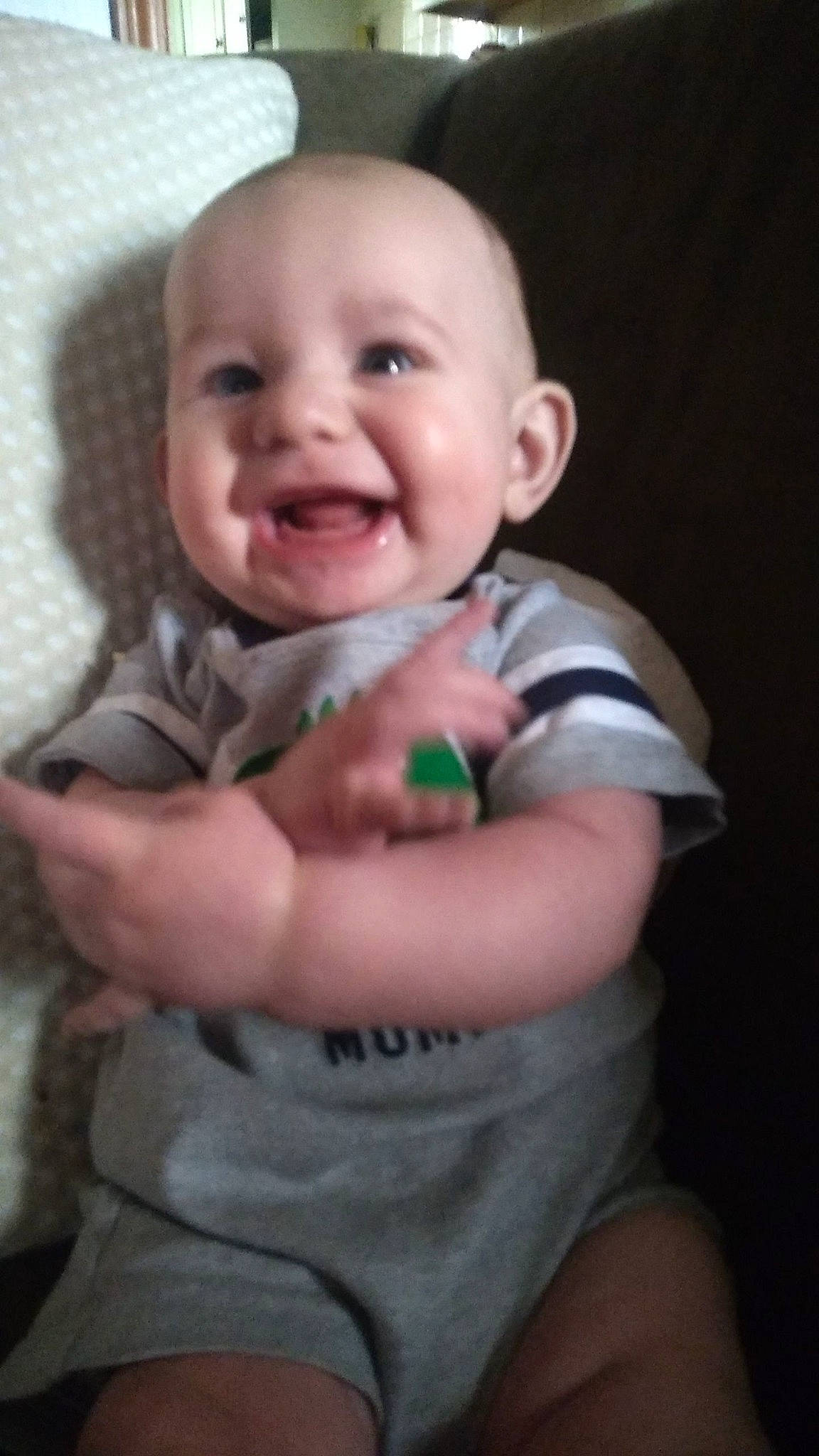 Damon is registered to the contest to win money with this photo: arm, baby, baby_toddler_clothing, cheek, chin, eyebrow, finger, flash_photography, gesture, hand, happy, human_body, iris, joy, lip, mouth, neck, nose, person, skin