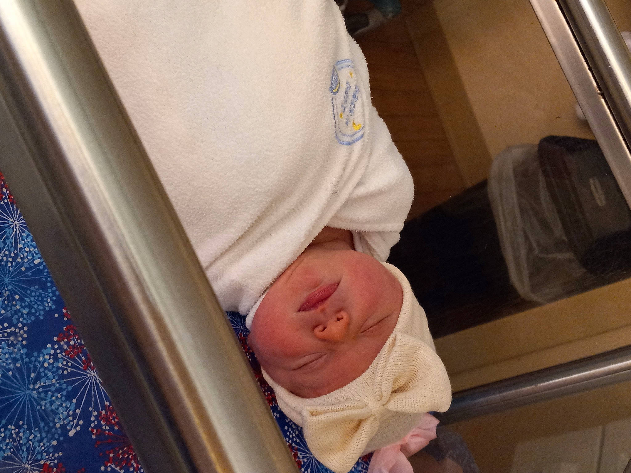 Addelyn is registered to the contest to win money with this photo: baby, baby_products, baby_safety, baby_toddler_clothing, child, comfort, electric_blue, headwear, linens, pattern, person, room, sitting, sleep, toddler, vehicle_door