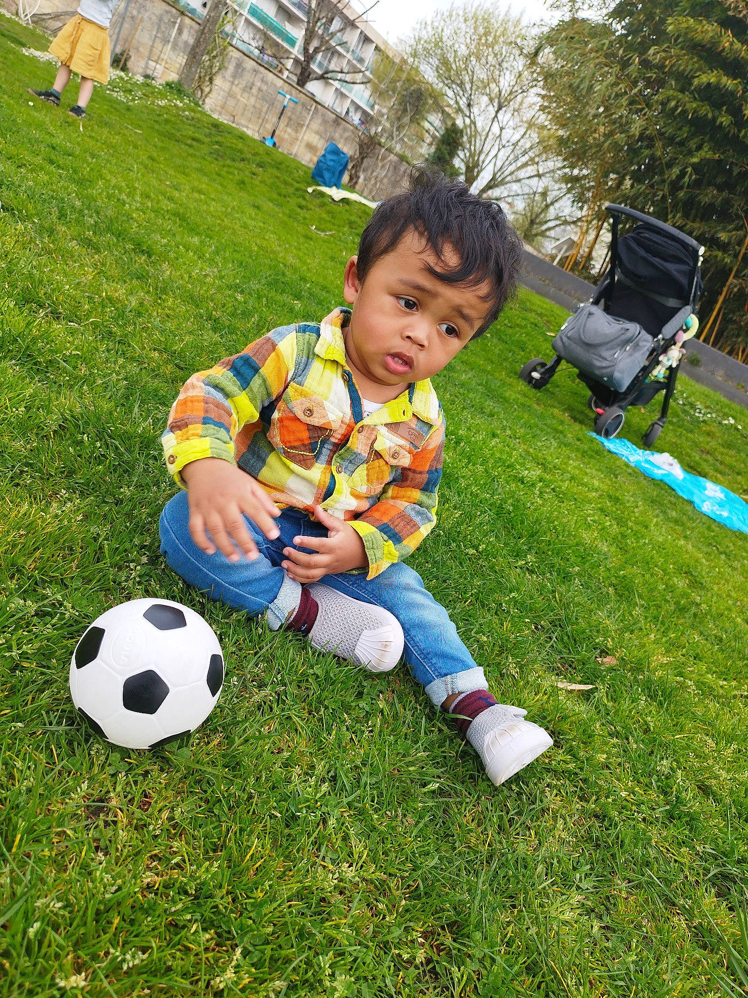 Asher participe au concours pour gagner de l'argent avec cette photo : ball, ball_game, child, flooring, football, fun, grass, lawn, leisure, people_in_nature, person, plant, player, recreation, shorts, soccer, soccer_ball, sports, sports_equipment, toddler