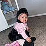 Daphne Zeinet joined the competition — help win amazing prizes! toddler, child, curly_hair, headband, pink_top, black_skirt, white_tights, black_boots, hello_kitty_purse, carpet, sitting, indoor, stuffed_animals, shelf, toy, cute, portrait, floor, young_child, fashion