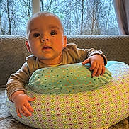 Dominykas joined the competition — help win amazing prizes! baby, background, blanket, child, clothing, cozy, curious, cushion, face, hand, home, indoor, infant, light, pattern, portrait, sitting, soft, tree, window