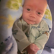 Khyyler is registered to the contest to win money with this photo: baby, infant, blanket, onesie, clothing, face, hand, portrait, child, cute, soft, warm, cozy, indoor, newborn, person, sleepwear, comfort, toddler, rest