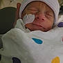 Khyyler joined the competition — help win amazing prizes! newborn, baby, infant, sleeping, blanket, hat, medical_tape, face, person, hand, indoor, cute, peaceful, closeup, portrait, colorful, soft_lighting, resting, tiny, wrapped