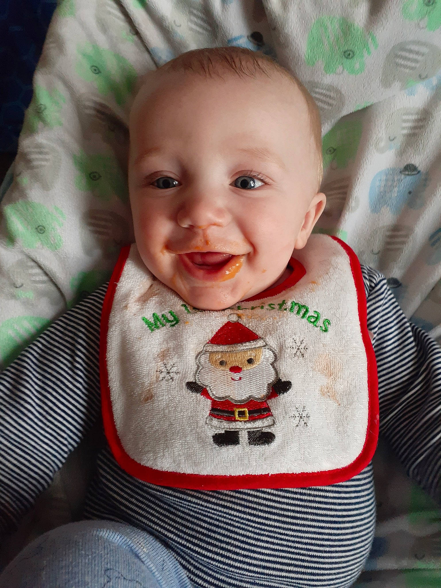 Greyson is registered to the contest to win money with this photo: baby, bib, cheek, child, chin, face, facial_expression, fictional_character, forehead, head, lip, nose, person, skin, sleeve, smile, t_shirt, toddler