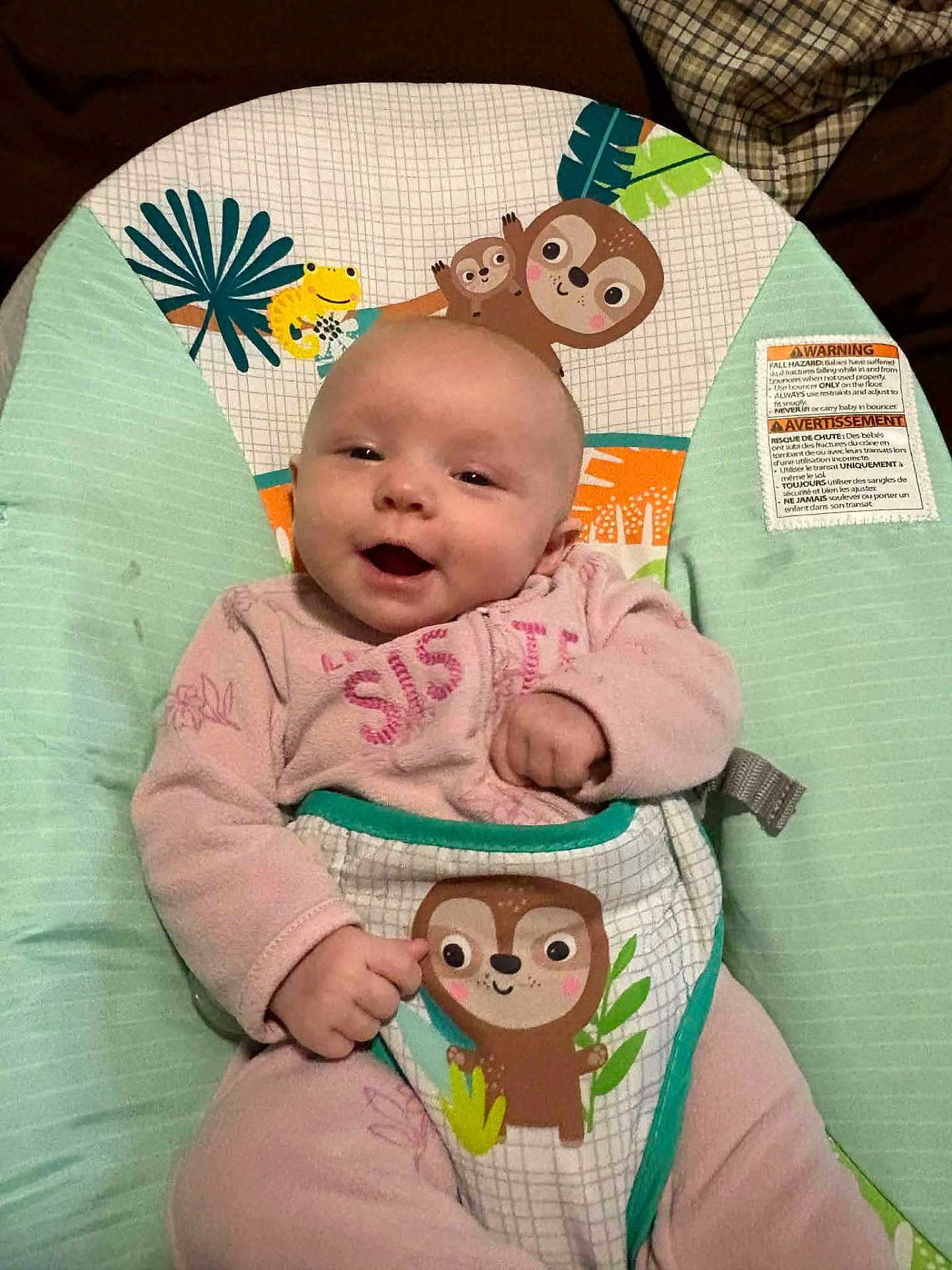 October joined the competition — help win amazing prizes! baby, infant, smiling, pink_clothing, baby_bouncer, sloth_illustration, frog_illustration, happy, cute, child, indoor, portrait, seated, fabric, pattern, playful, comfort, baby_girl, young_child, face