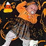 October joined the competition — help win amazing prizes! baby, pacifier, headband, orange_clothing, black_skirt, plush_toys, halloween_theme, blanket, candy_corn, purple_spider, ghost_plush, pumpkin_pattern, lying_down, infant, cute, holiday, costume, soft_toys, decor, indoor